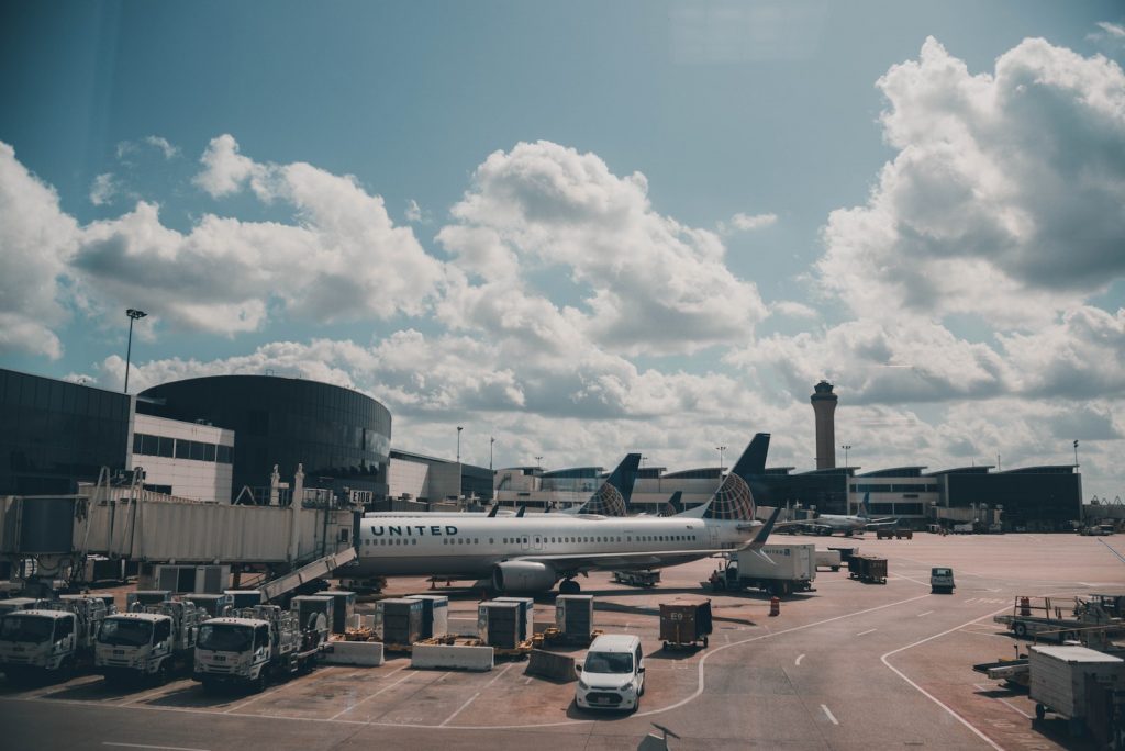White Airplane Under White Clouds